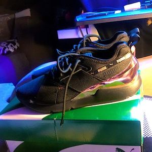 Black and rose gold pumas